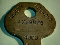 The bow of a Master Lock key, with keyway code (400B) and indirect bitting code (4XX9976) shown.