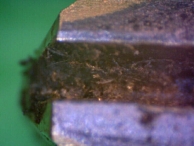 Medecoder type tool marks left on a Medeco Biaxial pin.