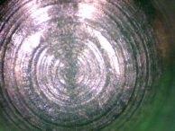 Close up of a brand new pin-tumbler pin, with distinctive milling marks.